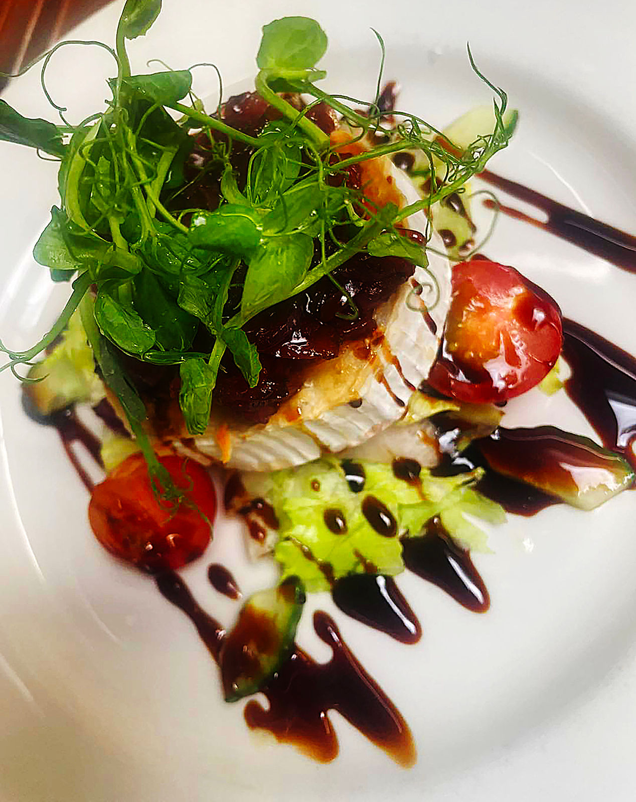 A plated dish from The Wheatsheaf Inn kitchen, ready to be served.