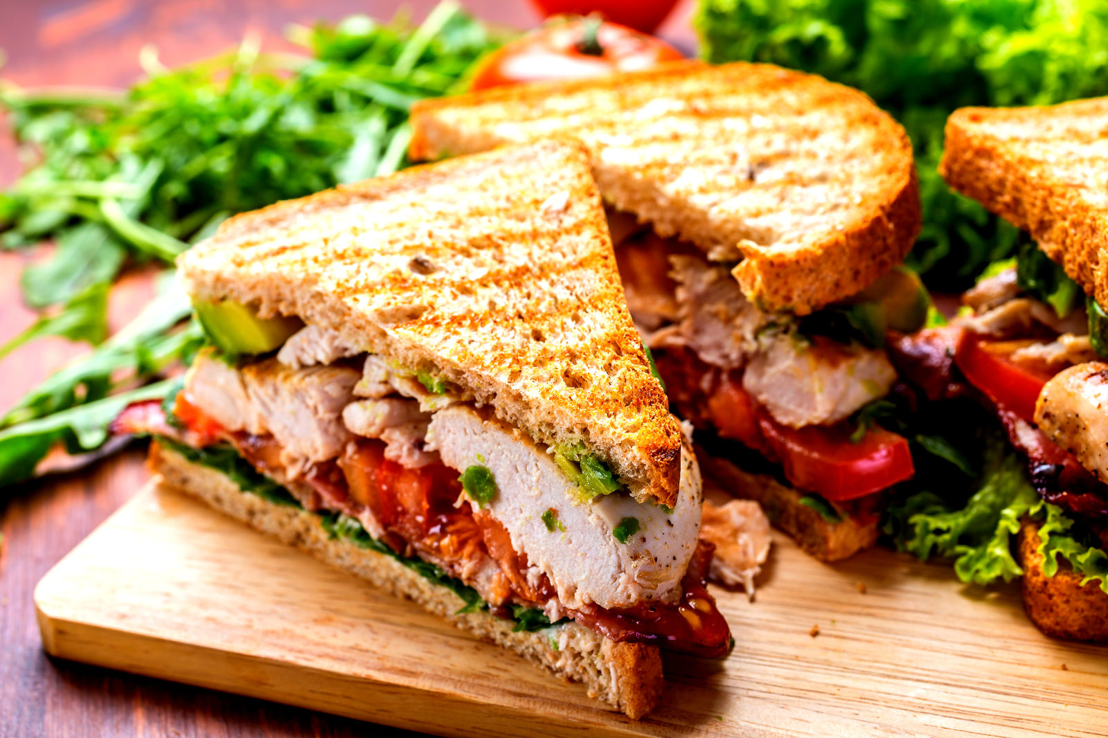A chicken sandwich served with salad, a light bite from the Wheatsheaf menu.